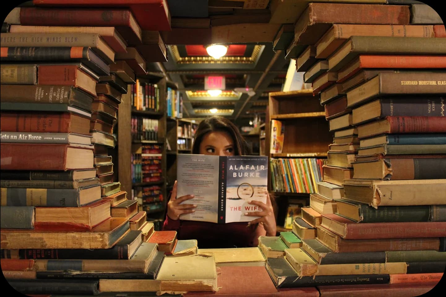 Girl reading book in a library