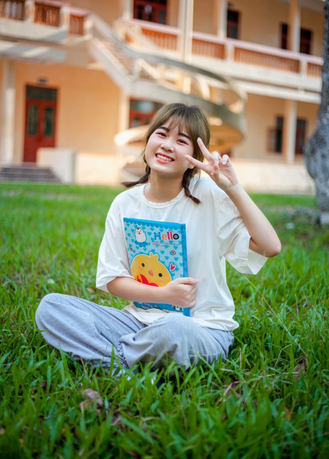 Girl smiling with peace sign
